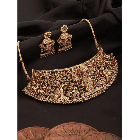 Gold-Plated Green AD Studded Radha Krishna Temple Jewellery Set.